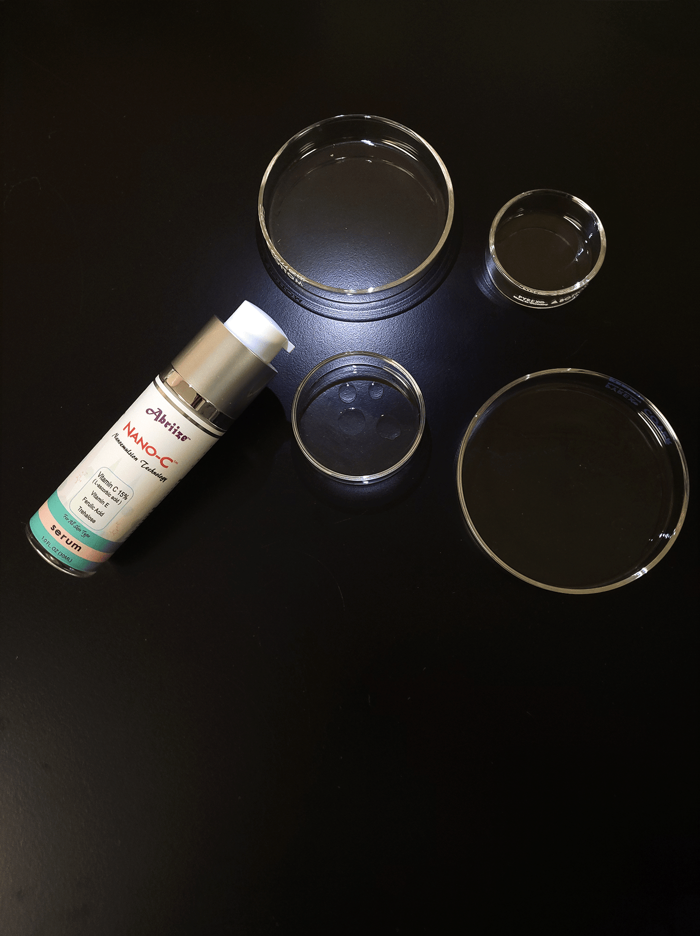 NANO-C 15% vitamin C, E, Ferulic Acid, Trehalose droplet clear and lightweight in a glass dish